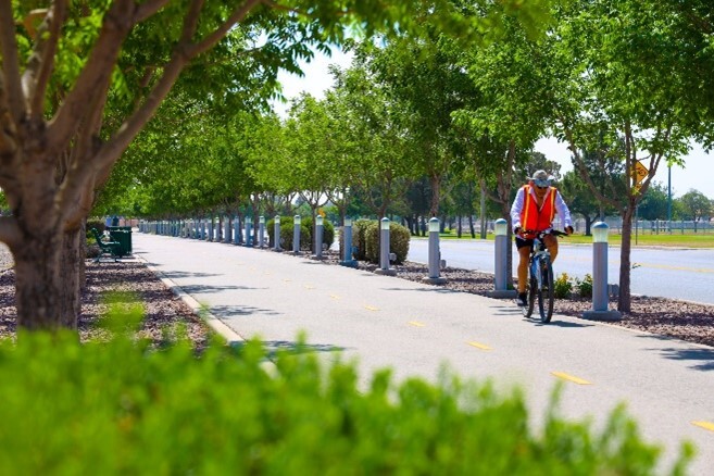 Man on bike along trail