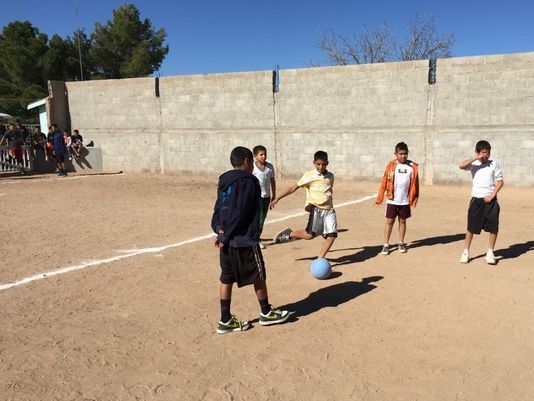 Residents of Puerto Palomas, Chihuahua, Mexico celebrate their new community sports center.