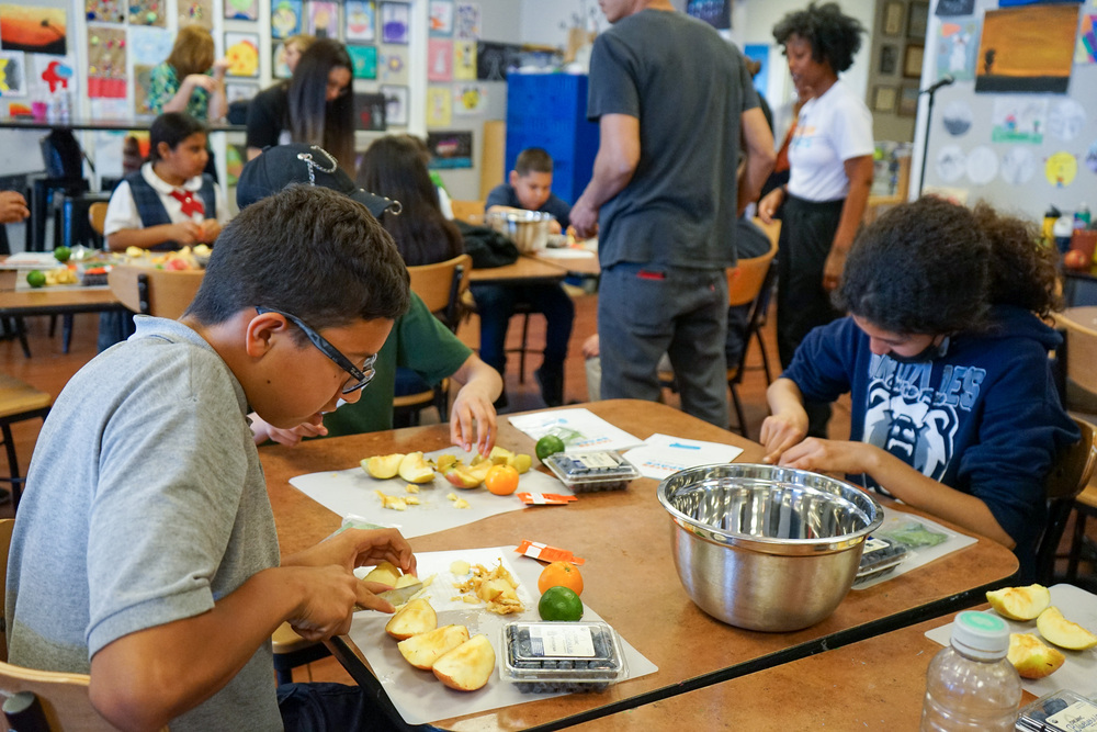 Kids prepare healthy snacks after school